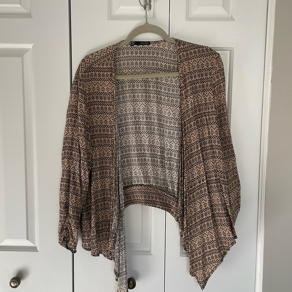 Brown and black shrug cardigan. Zipper detail in the back.